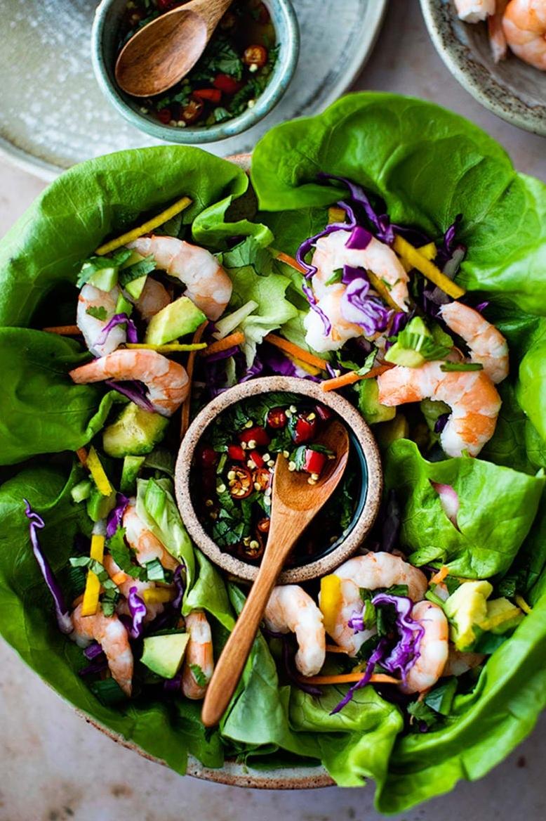  A colorful spread of fresh ingredients for the perfect shrimp lettuce wraps.