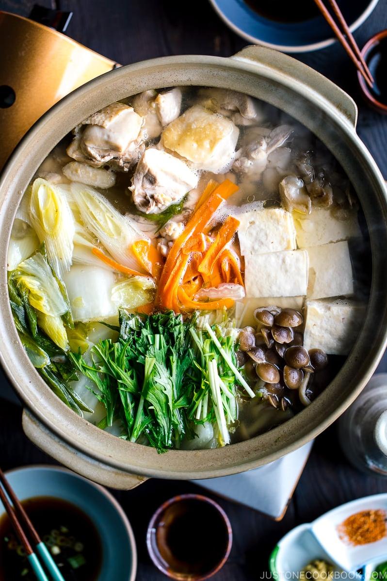  A delicious combination of tender chicken, earthy mushrooms, and creamy tofu make this hot pot a standout dish.