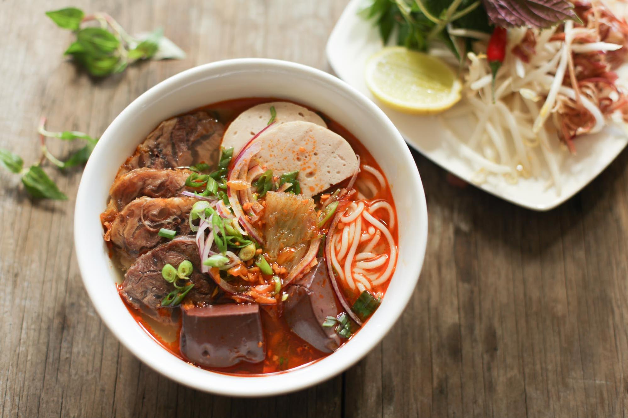  Add a pop of color and crunch with a side of fresh herbs to accompany your Bun Bo Hue.