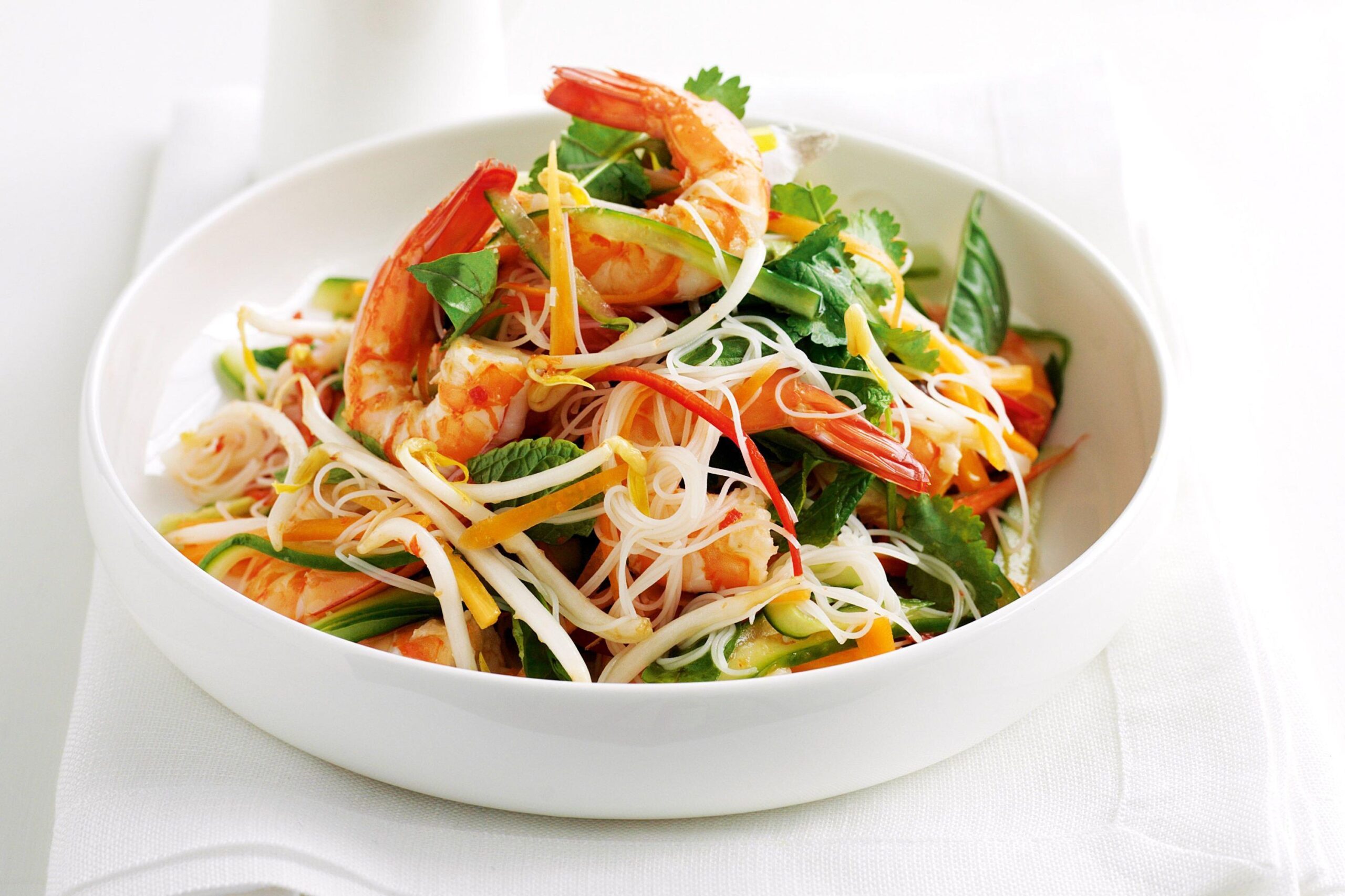  Experience a burst of flavors in every bite with our rice noodle salad.