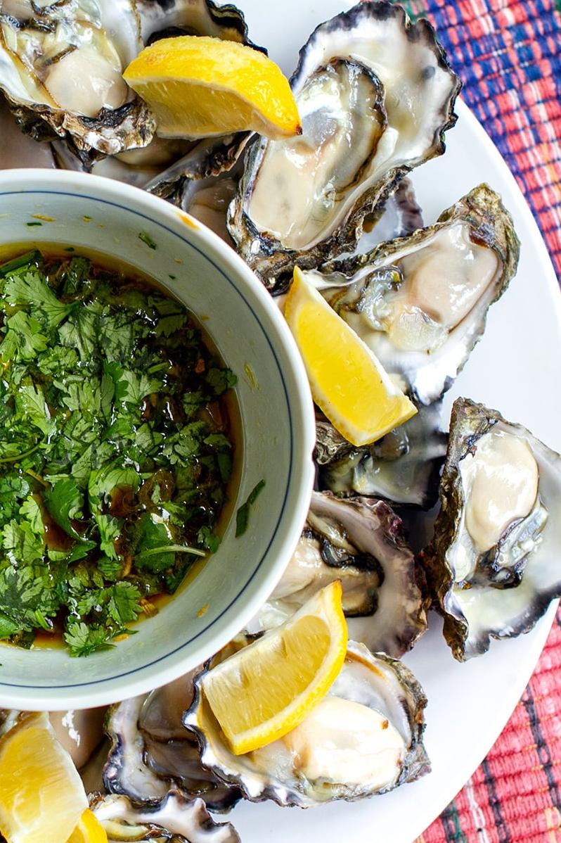  Feast your eyes on these succulent oysters drizzled in tangy ginger lime sauce.
