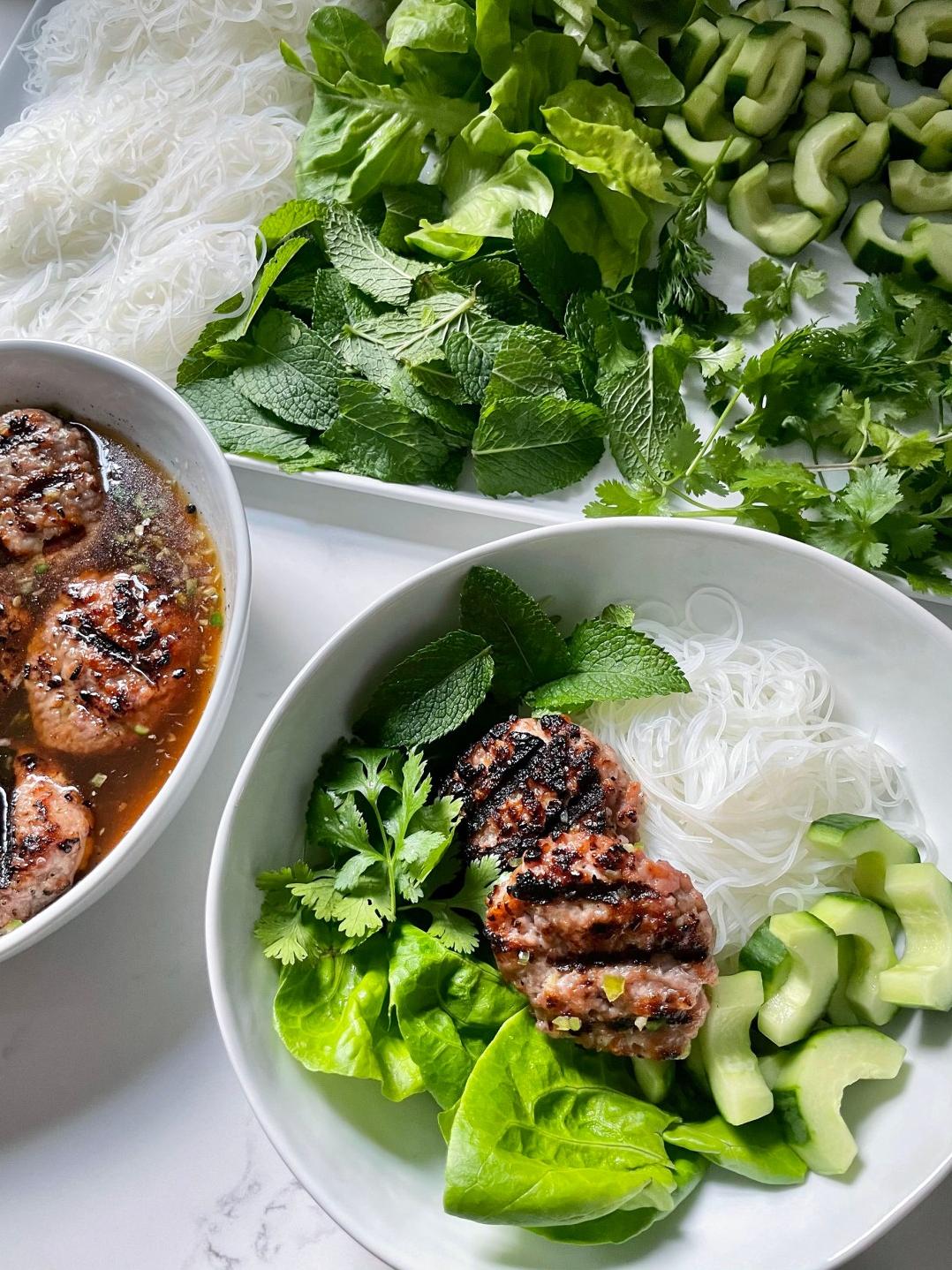  Juicy and flavorful pork patties, paired perfectly with the freshness of rice noodles and salad.