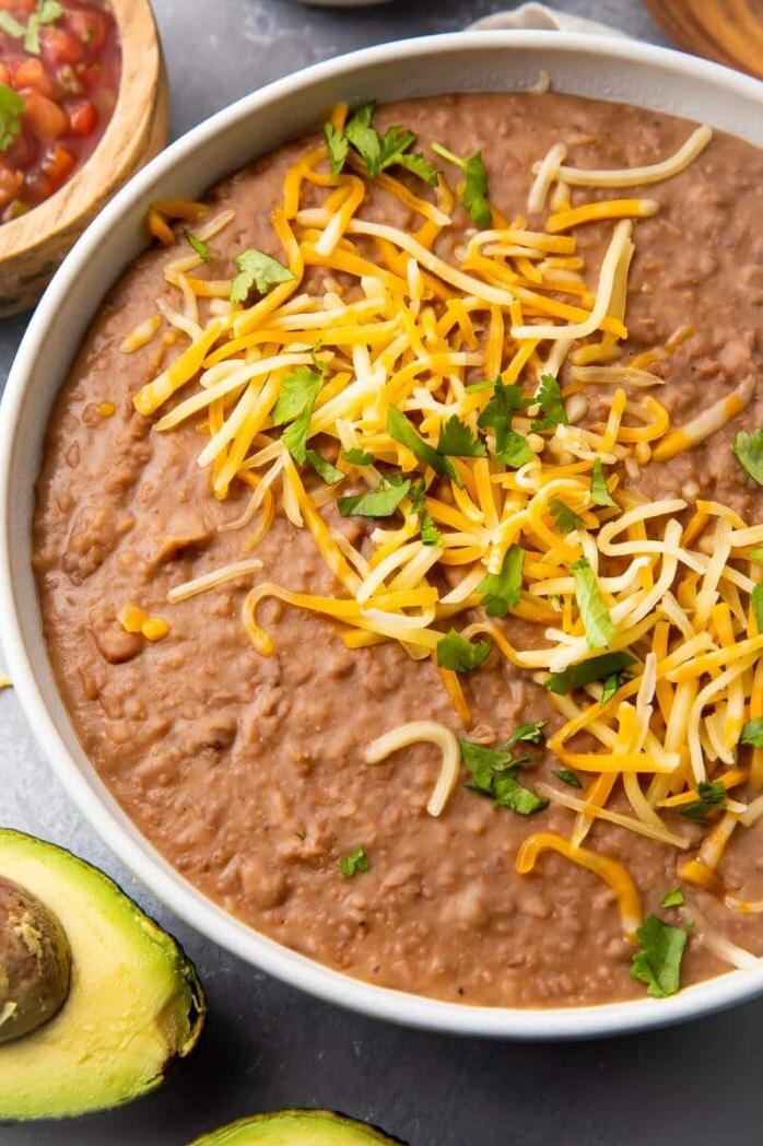  Spice up your snack game with this flavorful refried beans recipe!