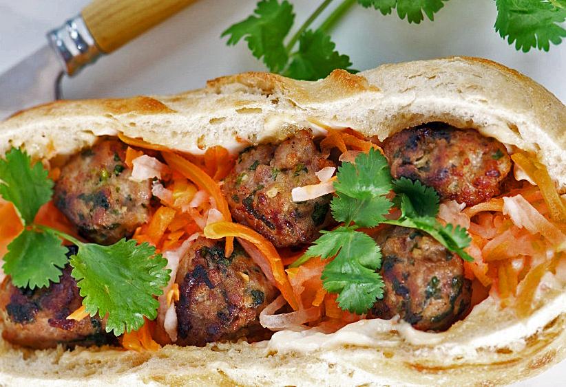  The combination of juicy pork meatballs and crunchy veggies make this sandwich a perfect meal.